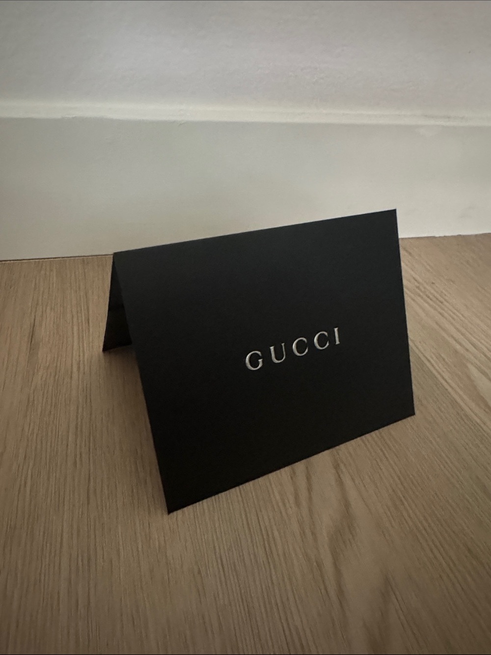 Gucci Black Card with Silver Embossed Logo